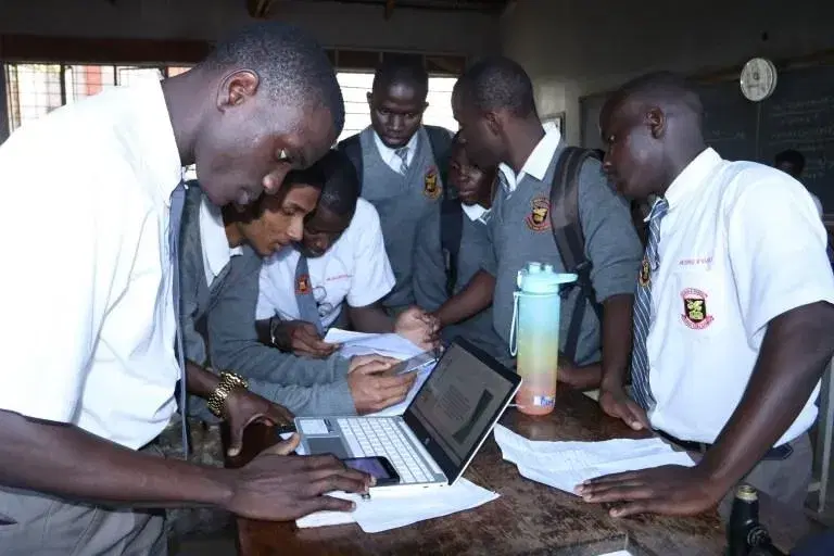 Students celebrating the completion of a class project